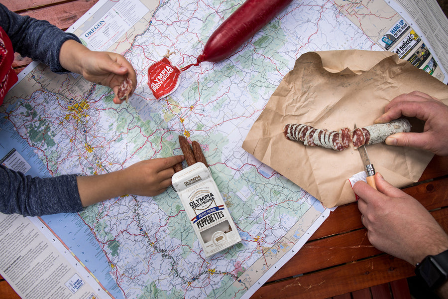 Olympia Provisions chatcuterie on top of a map of usa